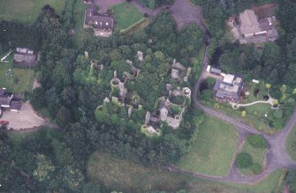 Oblique aerial view centred on the remains of the country house, taken from the S.
