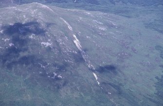 Oblique aerial view centred on the mine and buildings, taken from the SW.