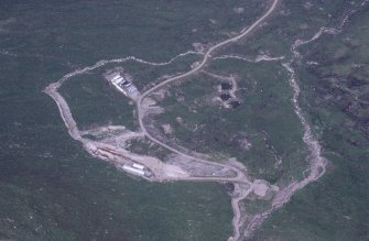 Oblique aerial view centred on the mine and buildings, taken from the SW.