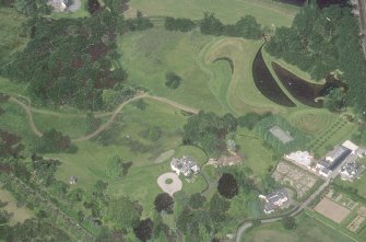 Oblique aerial view centred on the garden and country house, taken from the SSE.