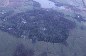 Oblique aerial view centred on house from W.
