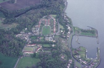 Oblique aerial view of Charlestown Village, Harbour and the remains of limekilns taken from the W