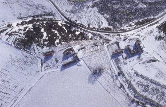 Badenyon, oblique aerial view, taken from the S, centred on the site of Badenyon Castle and the farmsteading.