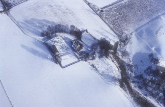 Kirkton of Glenbuchat, oblique aerial view, taken from the W, centred on the Old Parish Church, manse, and burial ground.