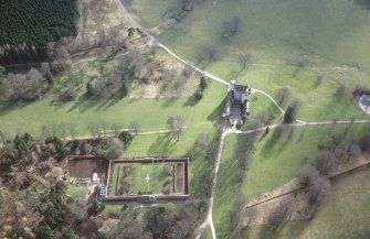 Oblique aerial view of the tower-house with walled garden adjacent, taken from the N.