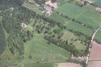 Castle Leod. 
Oblique aerial view, taken from the SW, showing the tower-house, a possible golf course and the gate lodge.