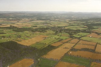 General oblique aerial view looking across Muir of Ord, taken from the NNW.