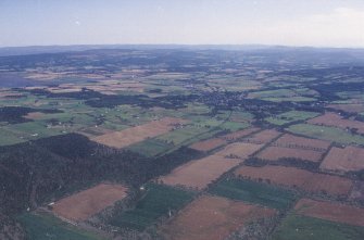 General oblique aerial view looking across Muir of Ord, taken from the NNW.