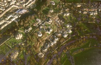 Oblique aerial view centred on Inveresk Gate, church and burial-ground, taken from the SW.