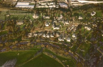 Oblique aerial view centred on Inveresk Gate, church and burial-ground, taken from the S.