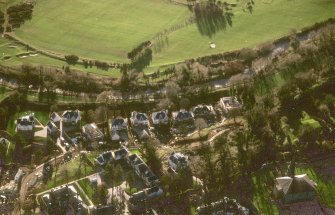 Oblique aerial view centred on Inveresk Gate, church and burial-ground, taken from the NNE.