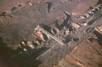 Oblique aerial view centred on the quarry, taken from the SE.