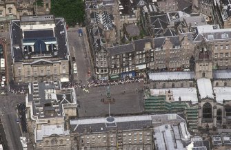 Oblique aerial view of Edinburgh High Street centred on the offices on the occasion of the visit of President Putin of Russia, 25 June 2003, taken from the SSE.