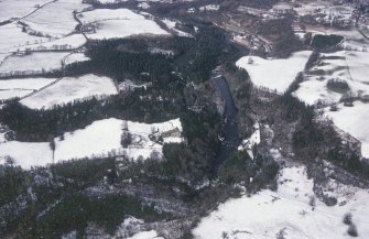 Oblique aerial view centred on Corehouse and power station with New Lanark adjacent, taken from the SE.
General view in snow.