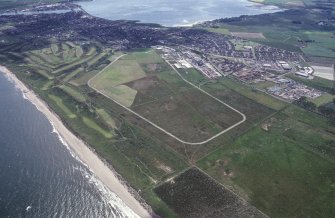 Montrose Airfield, oblique aerial view, taken from the NE, centred on the airfield and aircraft hangars.