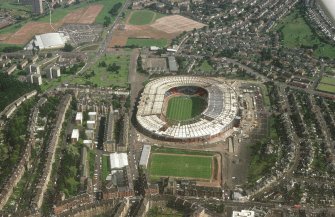 Oblique aerial view of Hampden Park under reconstruction.