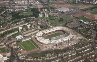 Oblique aerial view of Hampden Park under reconstruction.