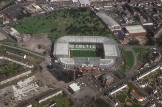 Glasgow, Parkhead, oblique aerial view, taken from the SW, centred on Celtic Park football stadium, and showing the Eastern Necropolis graveyard in the top half of the slide.