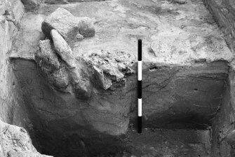 One of a group of excavation photographs: blocks 3, 7 and 8 showing midden layers and revetment walls F139, F133; view from E of S end of area B section and structure 2; F130 and bone F138; general view of F102, F101 and interior area: general view of masonry and wheelhouse; S facing section through F107, layers F127, 130 and pottery at base of F145; block 15 peat ash in F144; general view of excavation from E; N facing section through F107; section through F107; F144; general view from E structure 5 and F155; excavation of tumble of F101; post-ex of pit possibly F485; general working shots of excavation areas A and B.