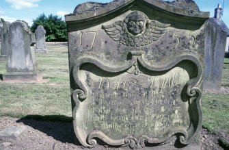 View of headstone d. 1755 with winged soul, Liff Old Parish Churchyard.