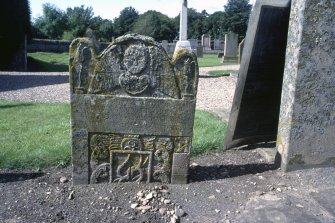 View of headstone to Katherine Carnegie and John Towns showing plough and winged angel, Stracathro  Parish Churchyard.