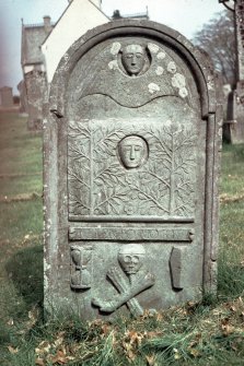 View of headstone to Louisa McDougall d. 1789, with death mask (portrait?) and roses, Kenmore Parish Churchyard.