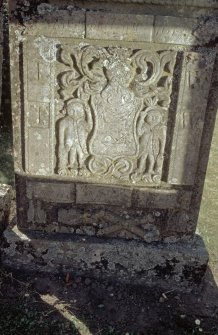 Detail of headstone to McNab 1799 with 2 figures and tradesmen's emblem, Kirkton of Lethendy burial ground.