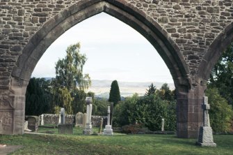 General view through archway of Old Church ruin, Muthill Old Parish Church burial ground.