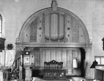 Furnishings, religious building fixtures and sound devices.  
Photographic view of interior showing organ case, pulpit and communion table.