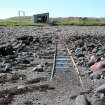 View looking W along slipway with boat house in background