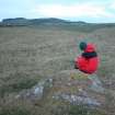 View of cup and ring marked rock outcrop from the W