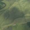 Oblique aerial view centred on the cropmarks of enclosures, henges, ring-ditches, a pit-enclosure and barrows, taken from the SE.
