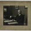 RCAHMS, SAPPP Publicity: Portrait of George Bennett Mitchell at his desk.