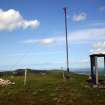 View of marker cairn, beacon and sentry box on summit of Castlelaw Hill, taken from SW