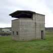 View.  Coast Battery Battery Observation Post (BOP) showing ground floor entrance and windows and first floor viewing platform with canopy from NE