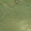 Oblique aerial view centred on the remains of the recumbent stone circle, taken from the SSW.