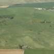 General oblique aerial view of the remains of the recumbent stone circle, taken from the SSE.