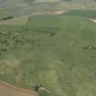 General oblique aerial view of the remains of the recumbent stone circle, taken from the SE.