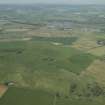 General oblique aerial view of the remains of the recumbent stone circle, taken from the SSE.