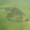 Detailed oblique aerial view centred on the remains of the recumbent stone circle, taken from the N.
