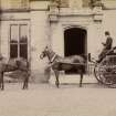 View of carriage with coachman and two horses outside St Fort House.