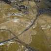 Oblique aerial view of the village, the railway and the remains of the field banks, taken from the NNE.