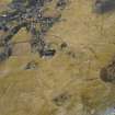 Oblique aerial view of the field banks and lazy beds with the village adjacent, taken from the NW.