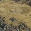 Oblique aerial view of the village and the remains of the field banks and lazy beds, taken from the E.