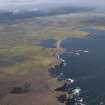 General oblique aerial view of centred on the crofting township looking along the coastline, taken from the NE.