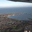 General oblique aerial view looking across Peterhead and Peterhead Bay towards the harbour and North Sea beyond, taken from the W.