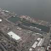 General oblique aerial view of Dundee centred on the docks, taken from the WNW.