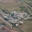 Oblique aerial view centred on the cement works, taken from the NNW.