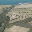 General oblique aerial view of the farm dairy and walled garden, taken from the SSW.