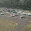 Oblique aerial view centred on the airport, taken from the SE.